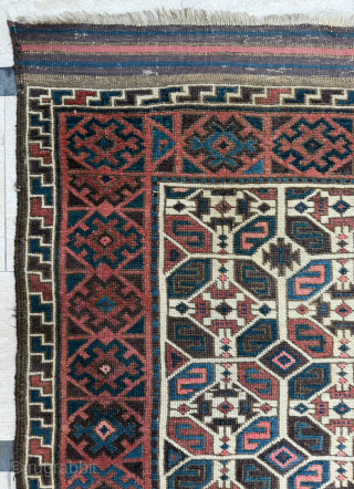 Middle of 19th Century North East Persia, Baluch Rug
In this Baluch rug of the head and shoulders type, the border is recessed at right angles in the upper section of the field,  ...
