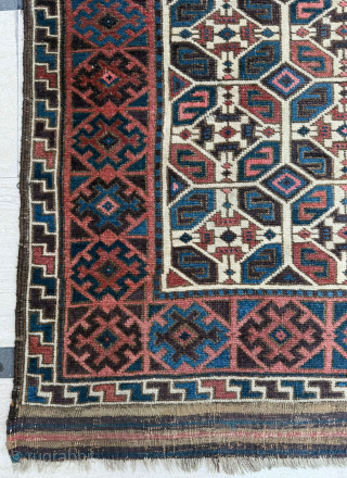Middle of 19th Century North East Persia, Baluch Rug
In this Baluch rug of the head and shoulders type, the border is recessed at right angles in the upper section of the field,  ...