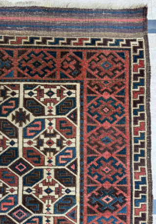 Middle of 19th Century North East Persia, Baluch Rug
In this Baluch rug of the head and shoulders type, the border is recessed at right angles in the upper section of the field,  ...