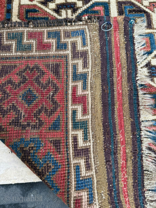 Middle of 19th Century North East Persia, Baluch Rug
In this Baluch rug of the head and shoulders type, the border is recessed at right angles in the upper section of the field,  ...