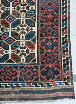 Middle of 19th Century North East Persia, Baluch Rug
In this Baluch rug of the head and shoulders type, the border is recessed at right angles in the upper section of the field,  ...