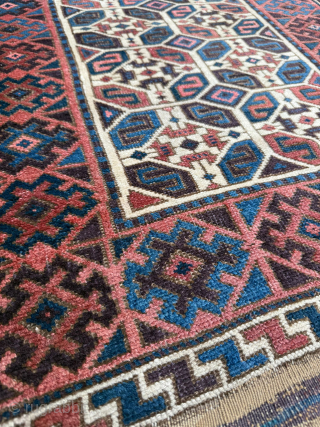 Middle of 19th Century North East Persia, Baluch Rug
In this Baluch rug of the head and shoulders type, the border is recessed at right angles in the upper section of the field,  ...