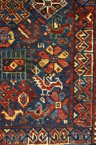 Beautiful Khamseh mat with rare square size (108x103cm). Outstanding colors combination on blue background. Full of symbols and tribal motives. See the green, yellow, brick red, ecru, white and blue and then  ...