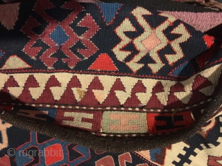 Antique kilim khorjin, Kurds of Varamin. 55” X 25-1/2”. Circa 1900. Good colors. Complete and in untouched original condition with intact edge wrapping and closure loops.       