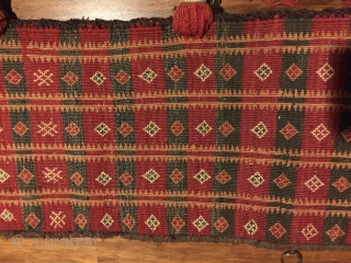 Baluch trapping, 72"x11" . First 1/2 20th C. All wool. Natural colors. Goat hair edge wrapping. Decorative tassels. Weft substitution weave. Nearly perfect condition.         