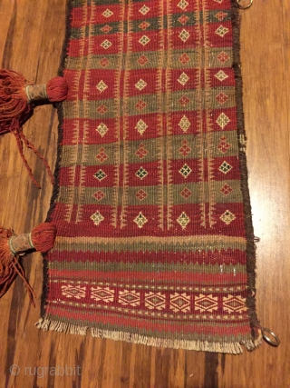 Baluch trapping, 72"x11" . First 1/2 20th C. All wool. Natural colors. Goat hair edge wrapping. Decorative tassels. Weft substitution weave. Nearly perfect condition.         