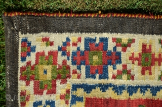 NW Persian flat woven khorjin. 57" X 25". Early 20th C.  Wool. Dovetailed tapestry. Bright stable cheerful colors. Plain woven back in natural undyed black wool. Lovingly kept in almost perfect  ...