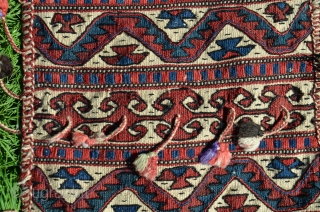 Western anatolian heybe, Kilaz, farda (kilim) technique. 4 ft. 2 in. X 1 ft. 2-1/2 in. Circa 1900. Wool. Probably a dowry/bridal piece with intact pompom tassels. Very good condition - slight  ...