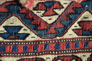 Western anatolian heybe, Kilaz, farda (kilim) technique. 4 ft. 2 in. X 1 ft. 2-1/2 in. Circa 1900. Wool. Probably a dowry/bridal piece with intact pompom tassels. Very good condition - slight  ...