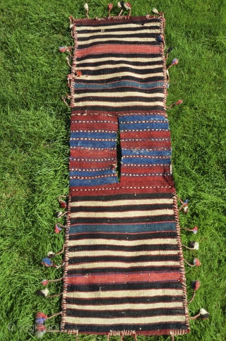 Western anatolian heybe, Kilaz, farda (kilim) technique. 4 ft. 2 in. X 1 ft. 2-1/2 in. Circa 1900. Wool. Probably a dowry/bridal piece with intact pompom tassels. Very good condition - slight  ...