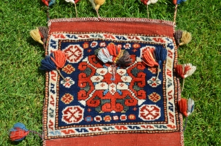 Exceptional West Anatolian pile heybe (Kilaz). 3 ft. 9 in. X 1 ft. 3 in. Circa 1900, possibly earlier. Wool. Brilliant natural dyes. Original condition with tassels intact. Probably a dowry piece.  ...