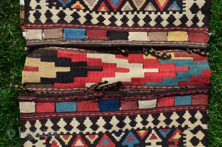 Shahsavan flat woven (kilim) khorjin with decorated bridge. 1'10" x 4'1". Circa 1900. Wool. Some faded fuchsin in a few motifs testifies to age. Otherwise all saturated natural dyes. Clean and in  ...