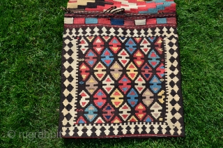 Shahsavan flat woven (kilim) khorjin with decorated bridge. 1'10" x 4'1". Circa 1900. Wool. Some faded fuchsin in a few motifs testifies to age. Otherwise all saturated natural dyes. Clean and in  ...