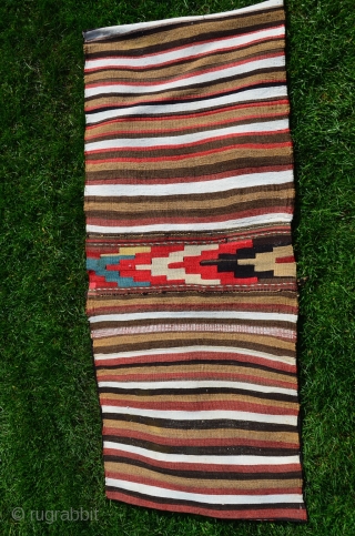 Shahsavan flat woven (kilim) khorjin with decorated bridge. 1'10" x 4'1". Circa 1900. Wool. Some faded fuchsin in a few motifs testifies to age. Otherwise all saturated natural dyes. Clean and in  ...