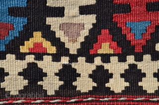 Shahsavan flat woven (kilim) khorjin with decorated bridge. 1'10" x 4'1". Circa 1900. Wool. Some faded fuchsin in a few motifs testifies to age. Otherwise all saturated natural dyes. Clean and in  ...