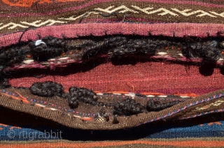 Large Baluch flat woven khorjin, 2nd. Q. 20th C. 64" X 34". Wool. Weft substitution designs on face, plain woven striped back. goathair fastening loops and edge wrapping intact. Excellent condition. No  ...