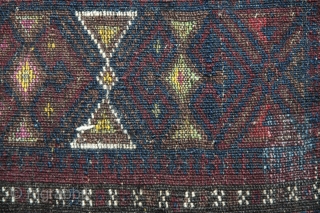 Baluch horse or mule chest trapping first quarter of 20th C 19" X 11" Wool pile, goat hair band, serene blue and purple tassels, silk highlights and added amulets; back with partial  ...