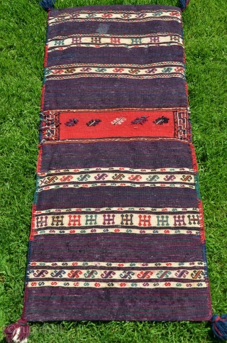 Kordi flatwoven khorjin. 44" X 19". First 1/2 20th C. Wool. Finely woven with pleasing color palette. Brocaded diamond pattern on face. Finely striped back; intervening stripes with brocaded decorative designs. .  ...