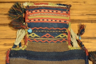 Antique Kordi salt bag, NE Iran. 22-1/2" X 13-1/2". Circa 1900. All wool. Brocaded face and decorated plain woven back in undyed natural wool.  Original carrying cord, tassels and edge wrappings.  ...