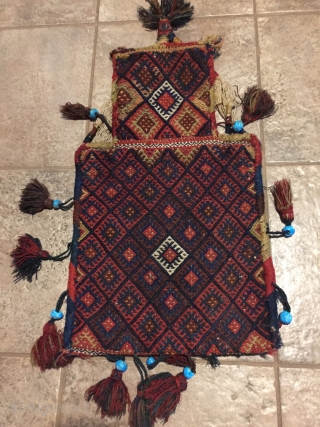 Antique Kordi salt bag, NE Iran. 22-1/2" X 13-1/2". Circa 1900. All wool. Brocaded face and decorated plain woven back in undyed natural wool.  Original carrying cord, tassels and edge wrappings.  ...