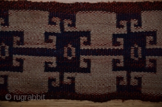 Persian malband, probably Shahsavan, 25 ft. X 3-1/2 in., wool, 19th C., tablet-woven (warp twining, two sets of colors, ivory and indigo warps and red-dyed wefts). Original ends. Small areas of damage  ...