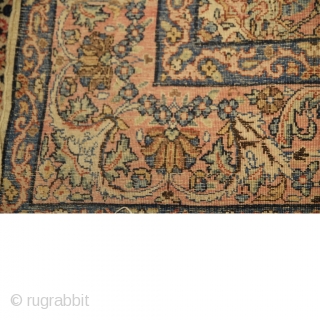 Antique Kirman Carpet
Size: 290cm x 178cm
Handwoven Antique Kirman Carpet, delicate blossoming medallion of flowers heads and sprays on a white ivory field. Pink corner spandrels encased in a delicate pink and blue  ...