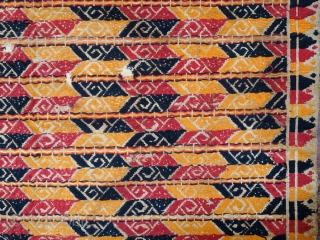 Indonesia | Antique ceremonial weaving tampan
 
Indonesia, Sumatra, Lampung, c. 1900
 
Handspun cotton base, supplementary weft weaving, botanical dyes, gold-wrapped thread 
 
A large, festive tampan with a colourful geometric design of  ...