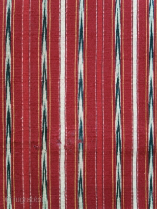 Sumatra | early 20th C Batak ceremonial textile Ulos Mangiring 

Sumatra, Batak people, Toba, Silindung; c. 1930

Commercial cotton, natural and commercial dyes, warp ikat, continuous supplementary warp weaving

A single dark rose red  ...