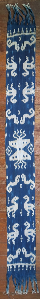 Sumba | indigo ikat men’s headcloth | Indonesia

East Sumba, Kanatang, 2nd half of 20th century

Commercial cotton, natural indigo dye, warp ikat

A headcloth (tiara) woven with large white ikat figures on an indigo  ...