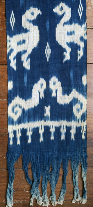 Sumba | indigo ikat men’s headcloth | Indonesia

East Sumba, Kanatang, 2nd half of 20th century

Commercial cotton, natural indigo dye, warp ikat

A headcloth (tiara) woven with large white ikat figures on an indigo  ...