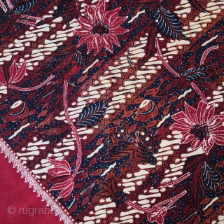 Java | Mid 20th C Hand-Drawn Batik Head Cloth (Iket Kepala)

Indonesia Java, Banyumas, mid 20th century

Commercial cotton and dyes, hand-drawn batik (tulis)

A dramatic ceremonial square that contrasts the cherry red square diamond  ...