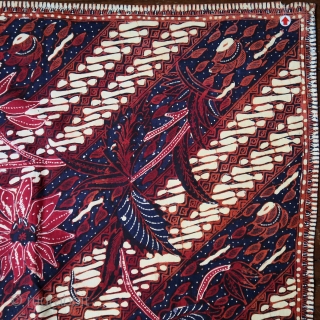 Java | Mid 20th C Hand-Drawn Batik Head Cloth (Iket Kepala)

Indonesia Java, Banyumas, mid 20th century

Commercial cotton and dyes, hand-drawn batik (tulis)

A dramatic ceremonial square that contrasts the cherry red square diamond  ...