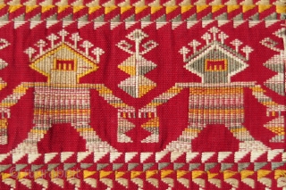 Borneo ceremonial carry-cloth (pua belantan)

Malaysia, Sarawak, Saribas region, 1950 or earlier

Cotton, silk, supplementary weft wrapping (sungkit)

A long solid red centrefield decorated at the ends in detailed silk sungkit, depicting two rows of  ...