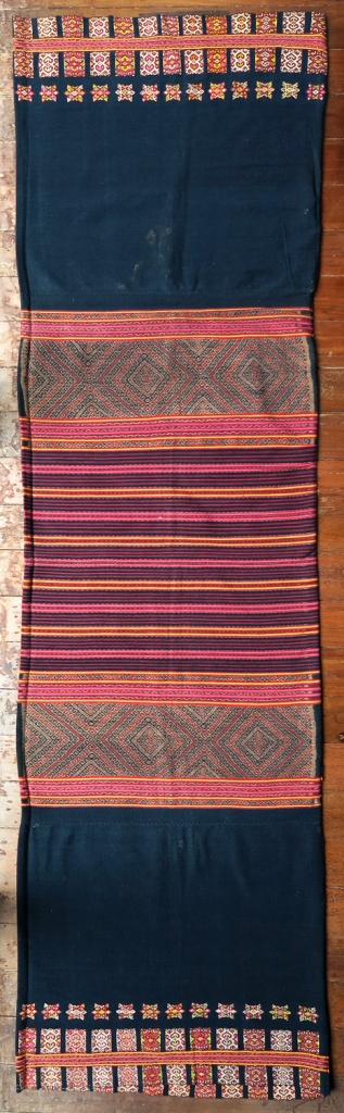 Timor ceremonial tubeskirt (tais mabuna)

Origin: Indonesia, West Timor, Biboki, 1920-1940

Technique: Handspun cotton, natural indigo and morinda dyes, commercial silk thread in synthetic dyes, warp ikat, supplementary weft wrapping (buna)

Description: A complex traditional  ...