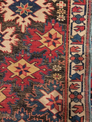 small Kuba rug with great natural color and a repeat star or snonwflake design on an oxidized dark ground giving a fantastic sculptural effect. 2'10"x3'10"        