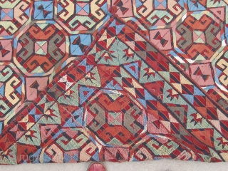 Bold wool-on-wool suzani. Kungrat Uzbek.  5'4" x 7'4" (162 x 224 cm). Densely  embroidered on a fine strip woven red and blue jajim. 1st half 20th C.  Terrific bed  ...