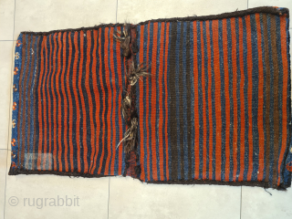 A beautiful nomadic saddlebag of the Luris from soutwest Persia. Made around 1920 or before. Wool on wool. Dyed with natural dyes (the orange is not a synthetic dye, unfortunately the colors  ...