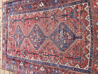 Antique Qashqai Khamseh rug in used condition. The rug has some thin patches (wear) but is still intact. The ends are open. Despite the patina, it is a beautiful bird rug with  ...