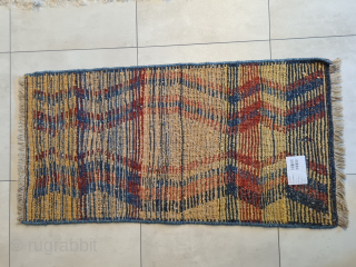A beautiful, cute, genuine, tribal Qashqai "children" gabbeh rug with stunning natural colors. Presumably intended as a children's sleeping rug. It features a stunning asymmetrical pattern. It is in very good condition.  ...