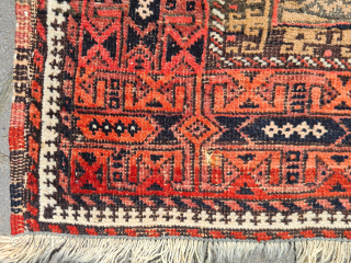A magnificent, rare tribal Baluch sofreh kilim. The border is knotted, while the simpler center section is woven in camel. A wonderful pattern combination. With signs of wear (see photos), presumably from  ...