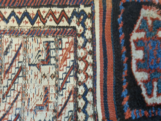 Antique opened Bakhtiari saddlebag/camel bag, made using three techniques (kilim, sumakh, and knotting). The piece has charm: lovely animal motifs on the white areas. Plant-based dyes. Dimensions: 240 x 93 cm. A  ...