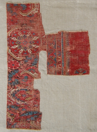 West Anatolian Rug Fragment, circa 17th century. Mounted. Size of linen support (Full size): 46x66cm (Fragment size: about 37x56cm).              