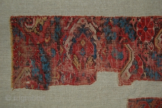 West Anatolian Rug Fragment, circa 17th century. Mounted. Size of linen support (Full size): 46x66cm (Fragment size: about 37x56cm).              