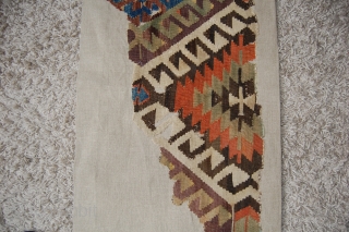 West Anatolian Kilim Fragment. Mounted. Size of linen support (full size): 58x158cm, fragment size: about 48x148cm.                 