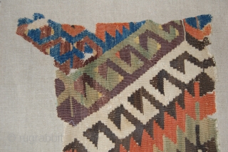 West Anatolian Kilim Fragment. Mounted. Size of linen support (full size): 58x158cm, fragment size: about 48x148cm.                 