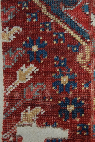 West Anatolian Ushak Rug Fragment. Mounted. Size of linen support (full size): 76x90cm, fragment size: about 66x80cm.                