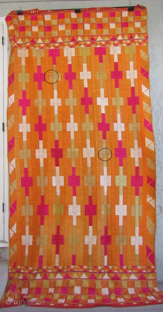 This Punjab Bagh phulkari measures 50 inches x 106 inches. There are 2 small areas where the magenta dye has bled onto a neighboring area where the cloth was folded. The overall  ...