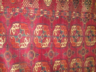 Antique Tekke Turkoman Rug.

size 11'4'' x 7'9''. condition very good for the age ,low even pile with one small spot lower then other part of the rug.  needs a bath.fine quality  ...