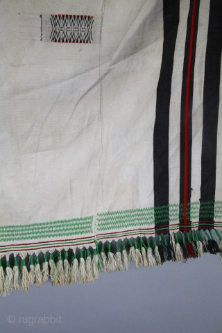 Angami Naga shawl, 
woven red and black stripes and patterns, 
white cotton. 
State of Nagaland, Northeast India. 
137 x 81 cm. 
Very good condition. 
Early to mid 20th century.    