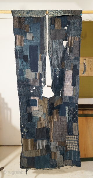Indigo Tsugihagi (Patch-Worked) "Boro" from 19th century Japan. 
This boro seems to have been a work wear, and been stored and waiting for being reformed again.
Now this doesn't have sleeves and the  ...